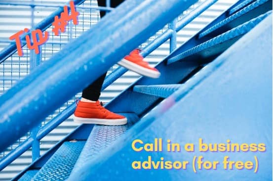 Orange shoes going up blue stairs with the words "Tip #4 Call in a business advisor (for free)"