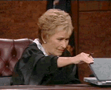 An .gif of Judge Judy closing a laptop with a disgusted look on her face
