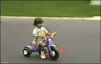 .gif of a little girl riding a tricycle, running into a curb, and falling flat on her face into grass